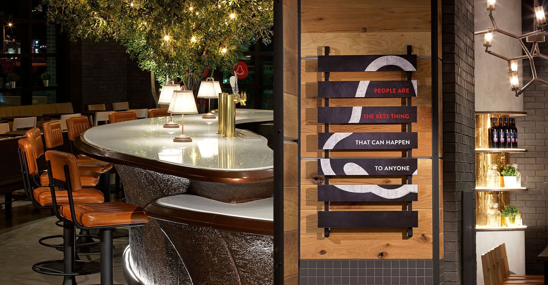 A restaurant with a long bar and a sign that says chill