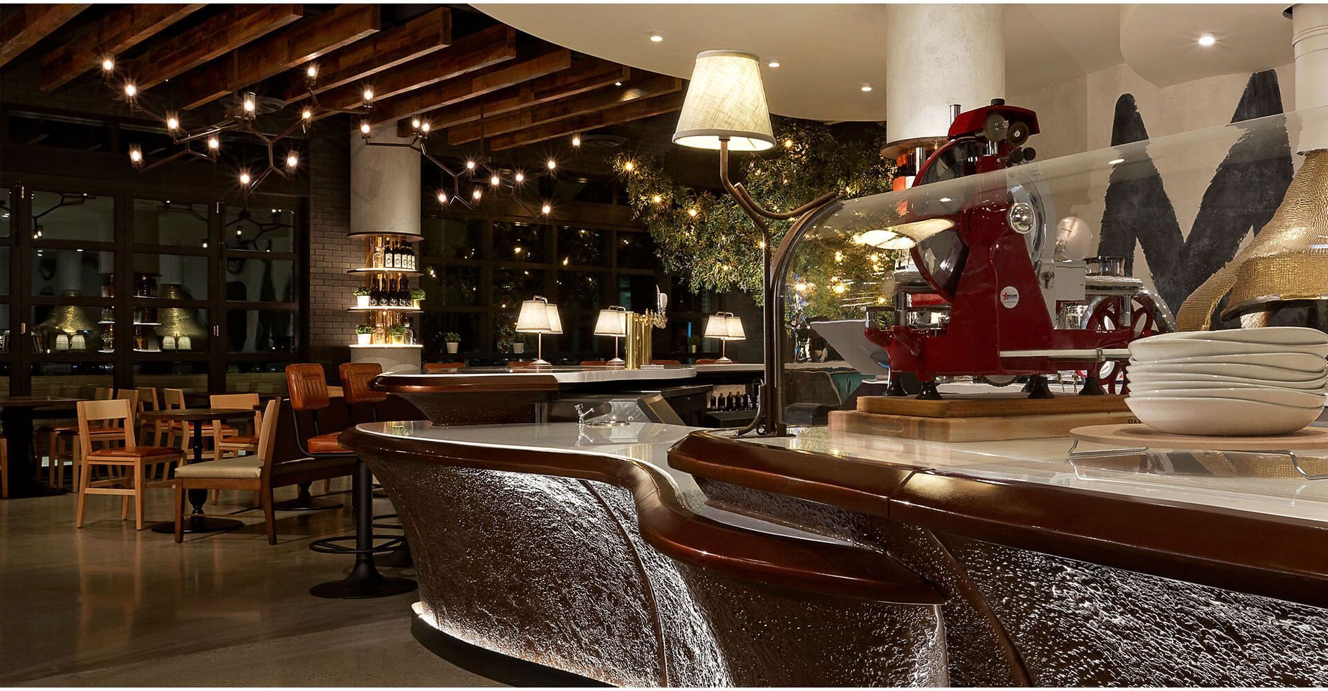 A restaurant with the letter m on the wall