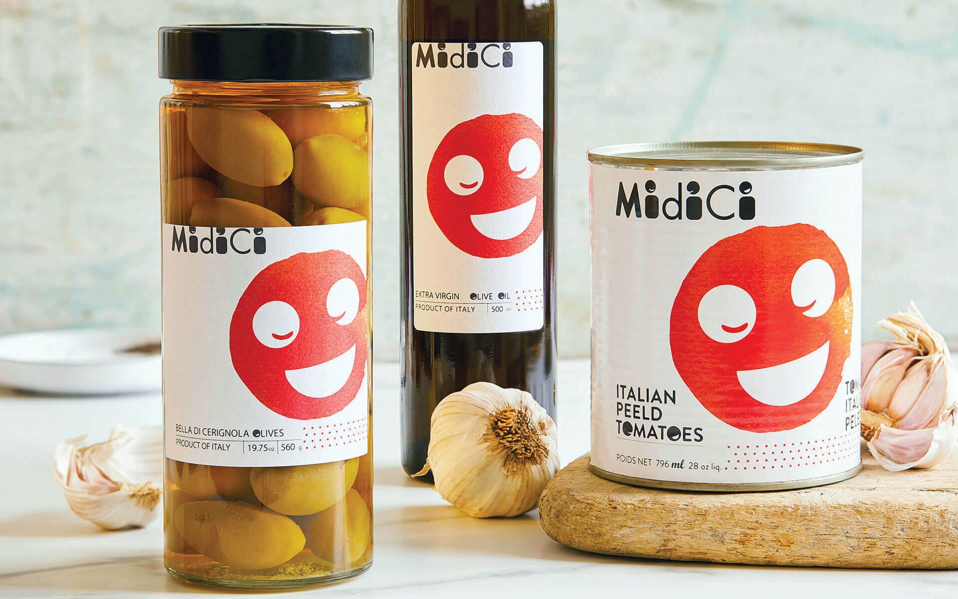 Three jars of food with smiley faces on them are sitting on a table.