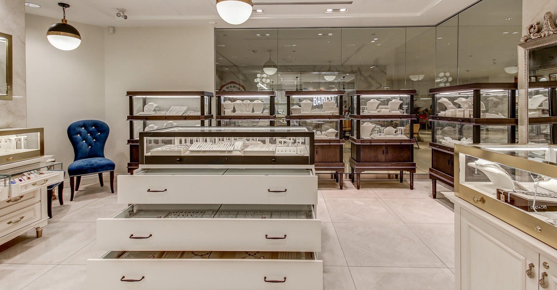 A jewelry store with lots of drawers and display cases.
