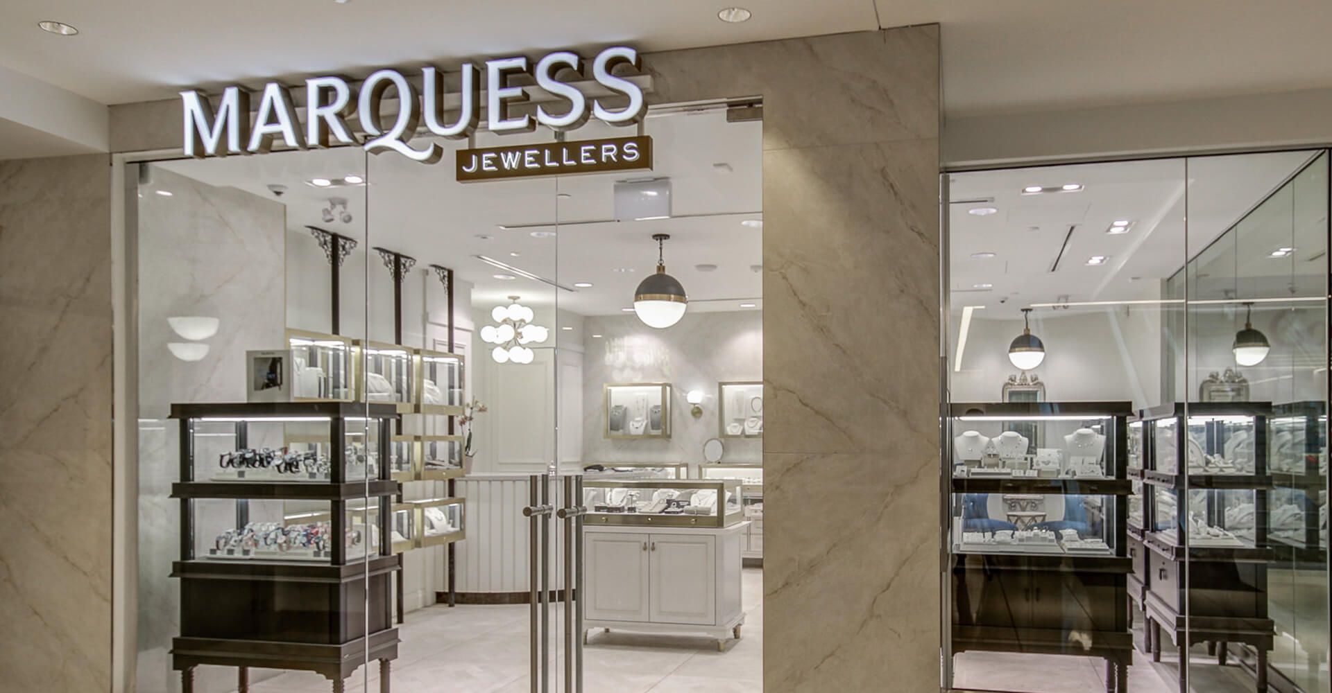 A jewelry store with a glass door and a sign that says marquis.