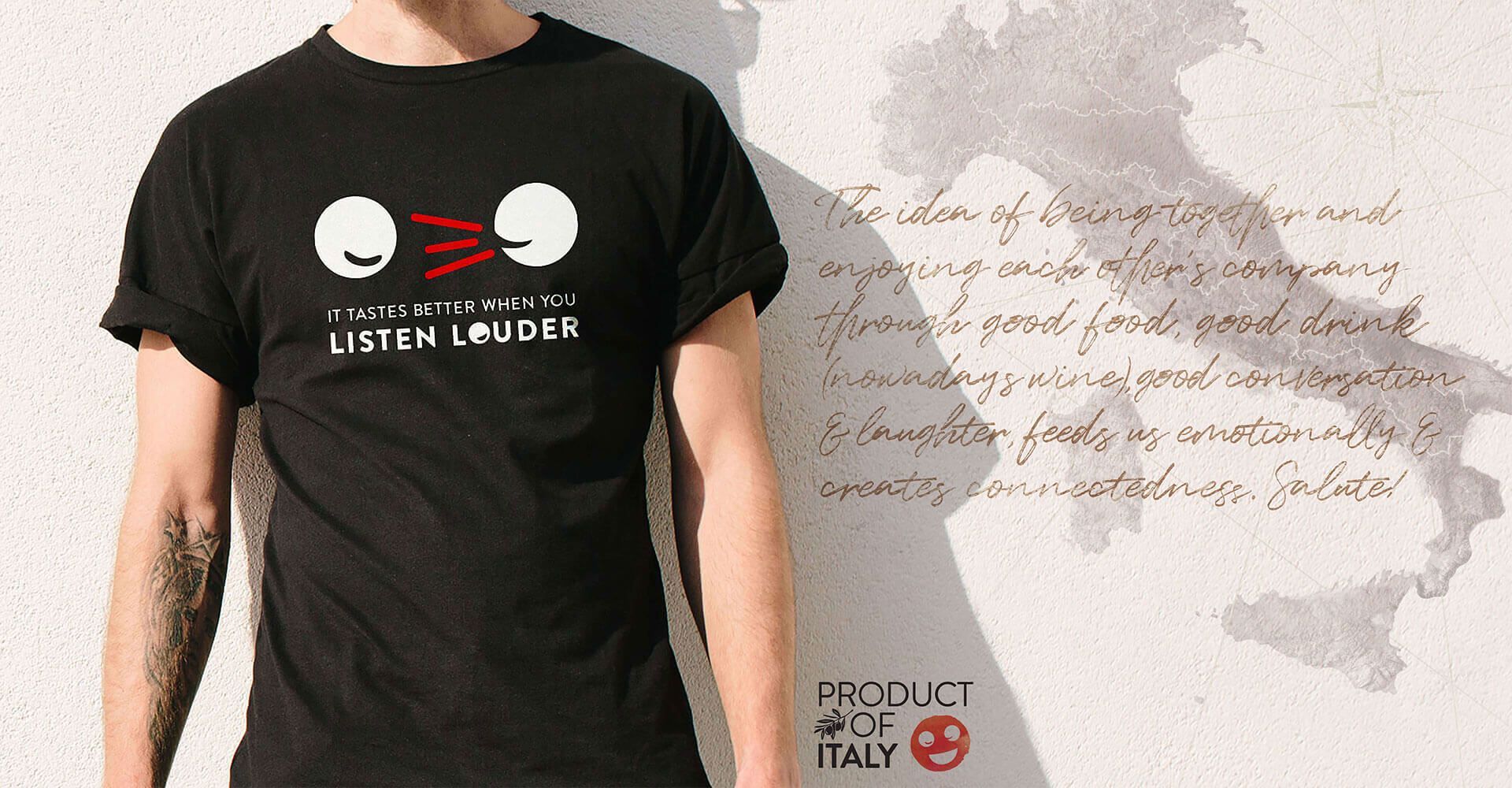 A man wearing a black t-shirt that says listen and dar