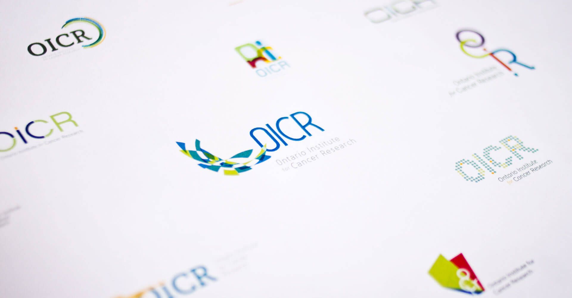A bunch of oicr logos are on a white surface