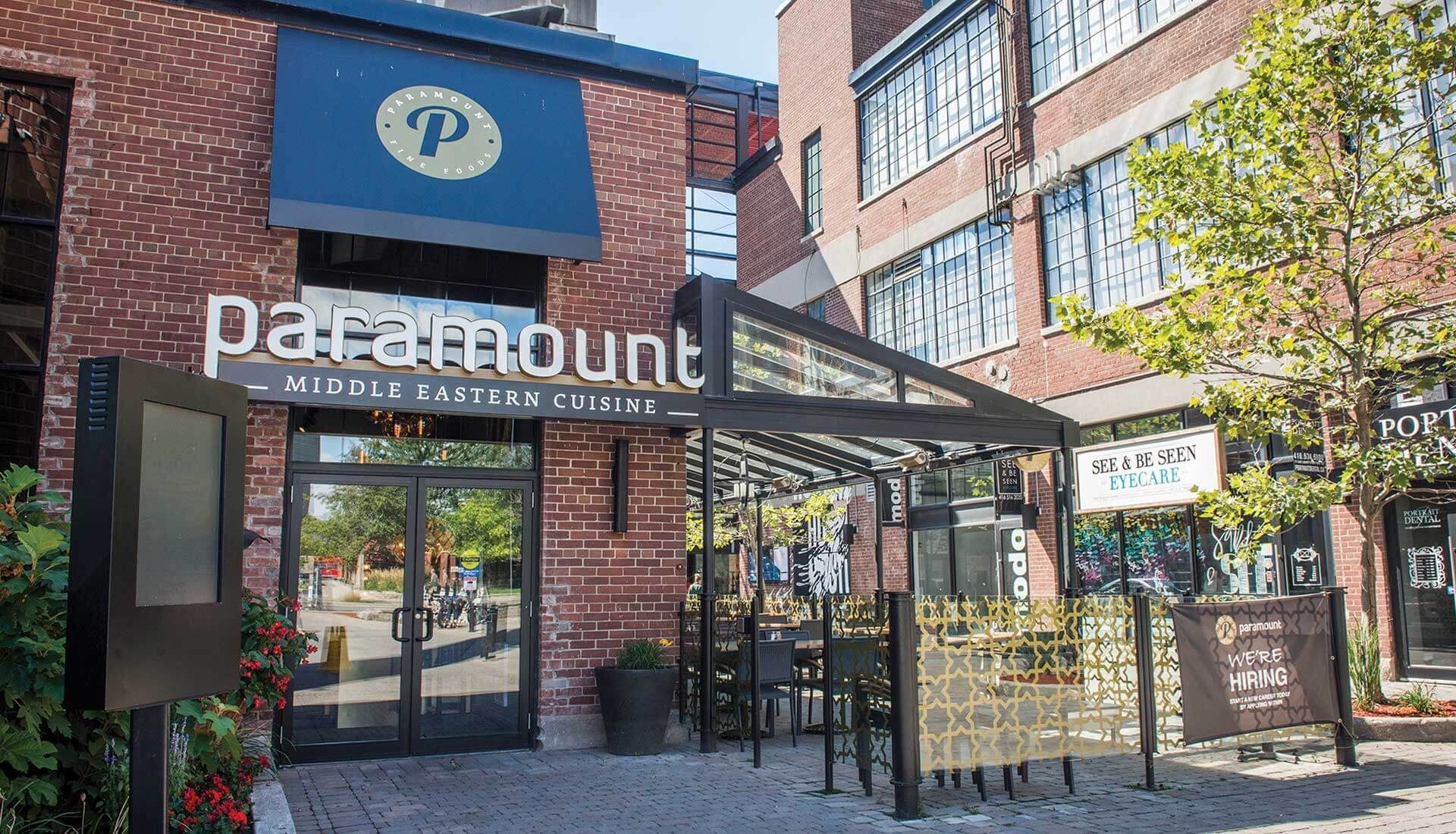 A restaurant called paramount is located in a brick building.