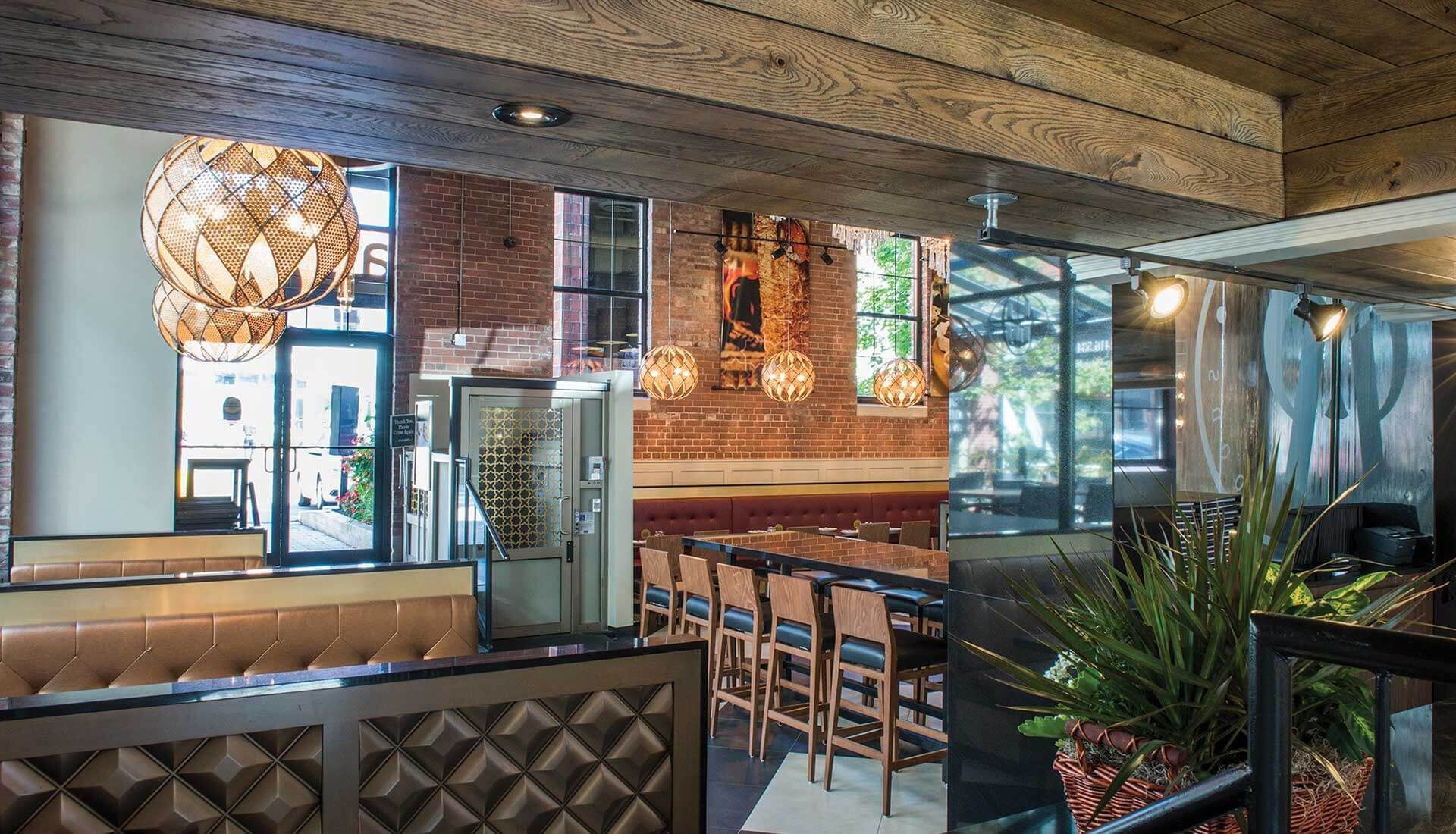 A collage of photos of a restaurant with a brick wall