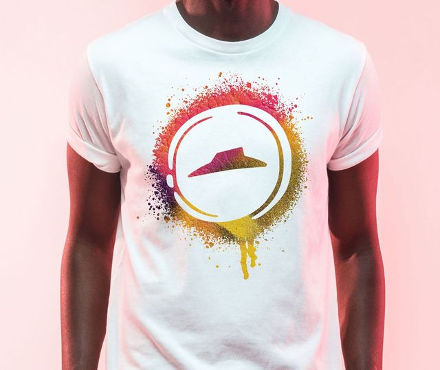 A man is wearing a white t-shirt with a pizza hut logo on it