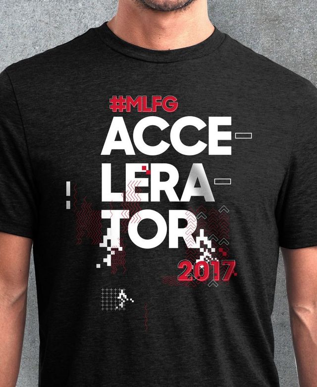 A man is wearing a black t-shirt that says accelerator 2017