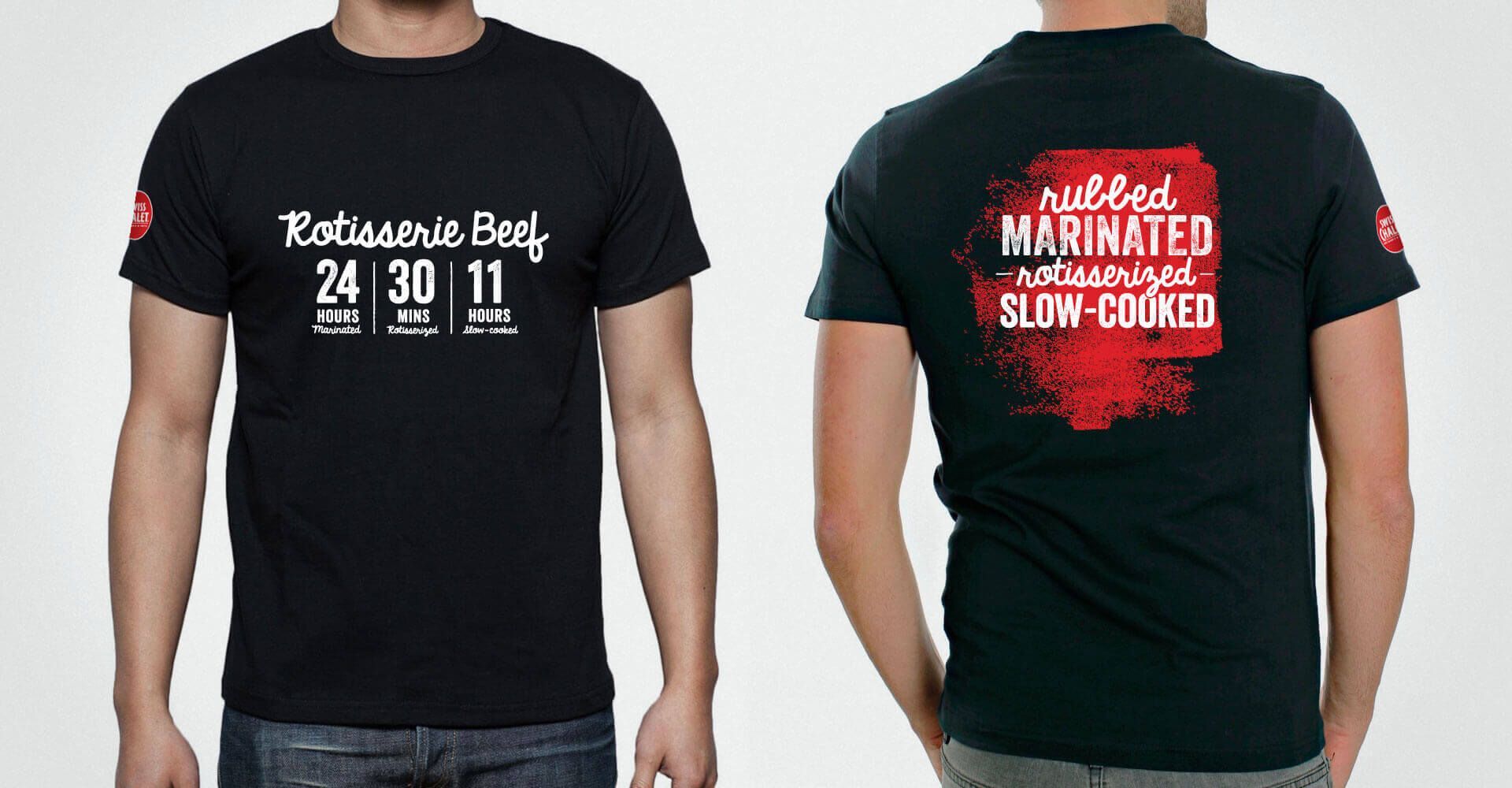 A man is wearing a black t-shirt that says rubber marinated slow cooked