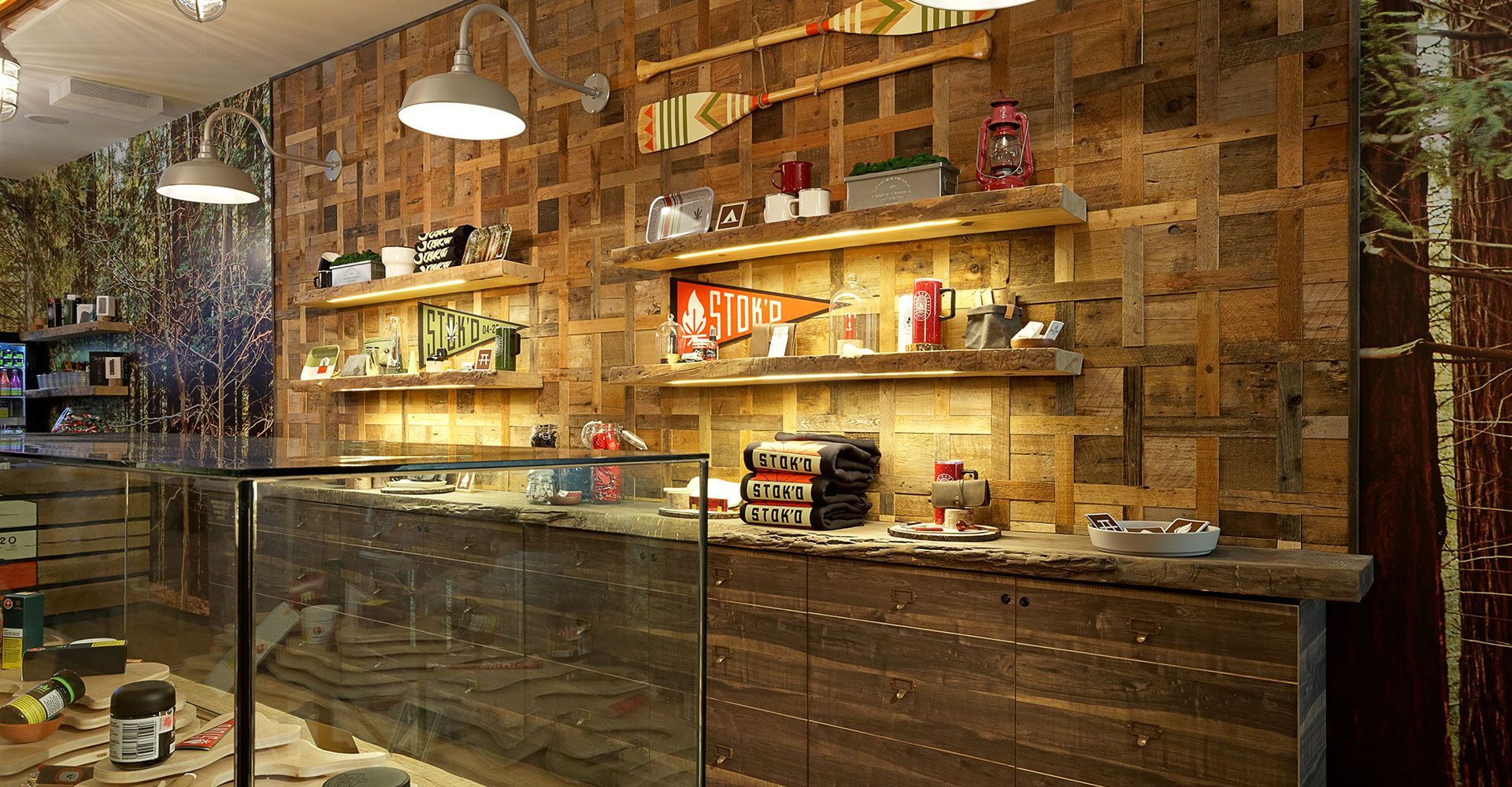 A restaurant with a wooden counter and shelves.