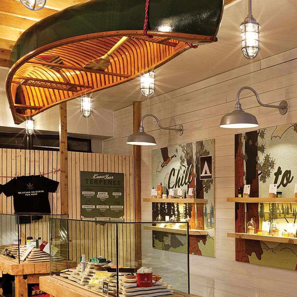 A store with a canoe hanging from the ceiling