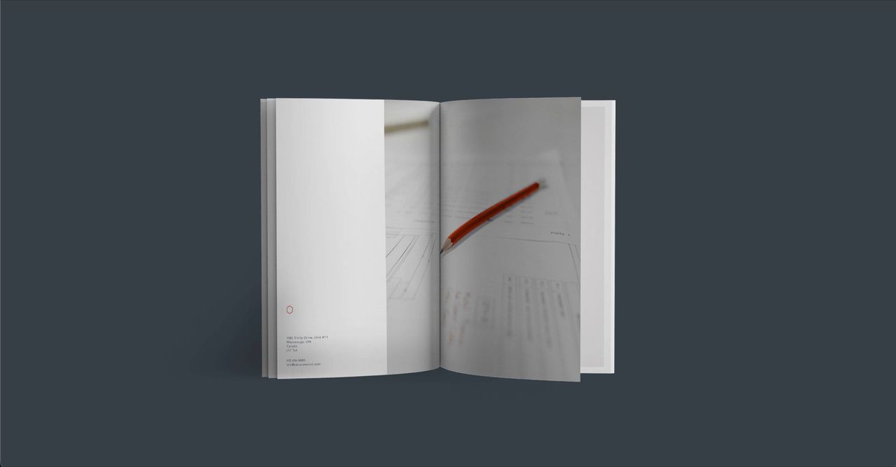 A book is open to a page with a pencil in it.