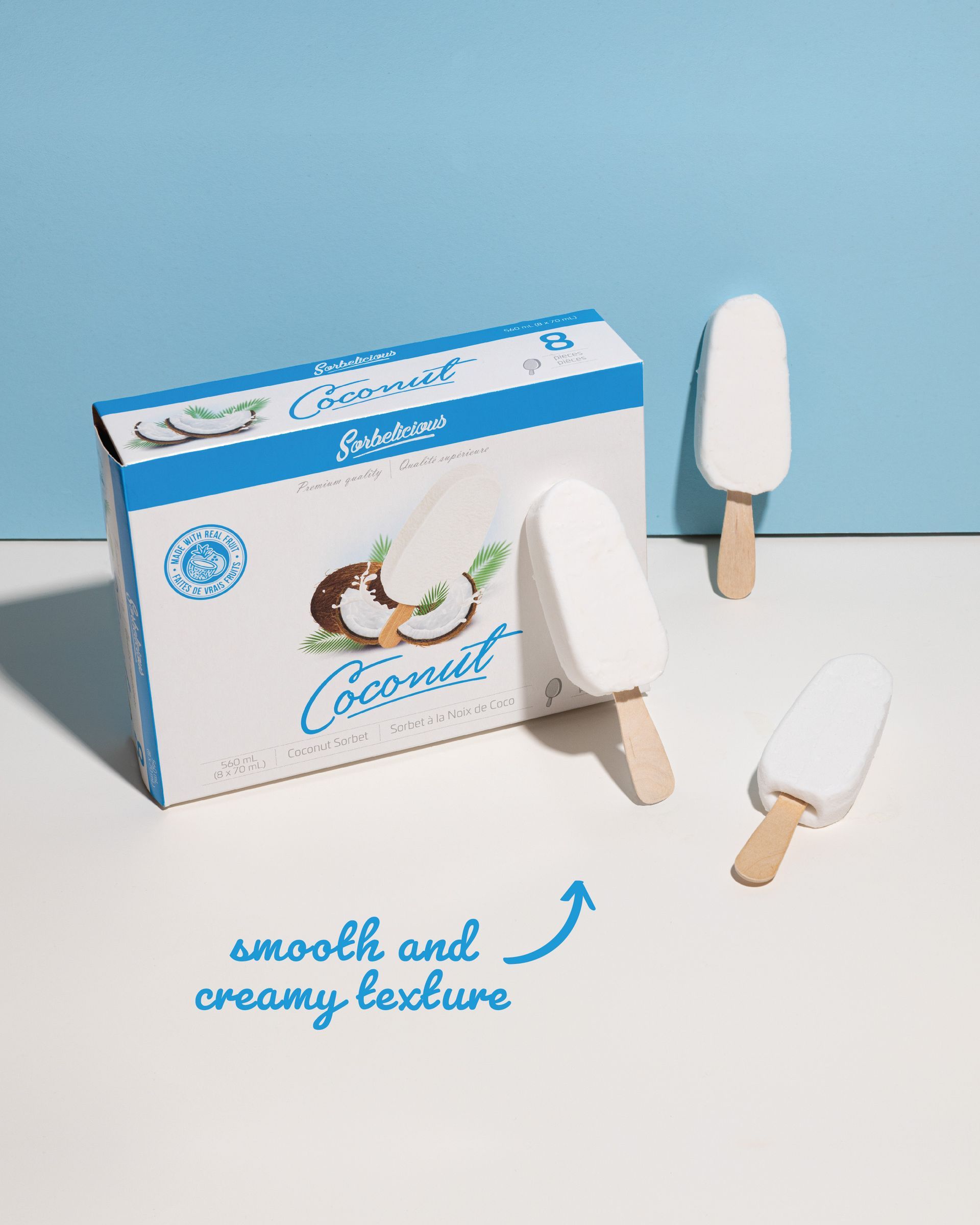 A box of coconut ice cream bars is sitting on a table.