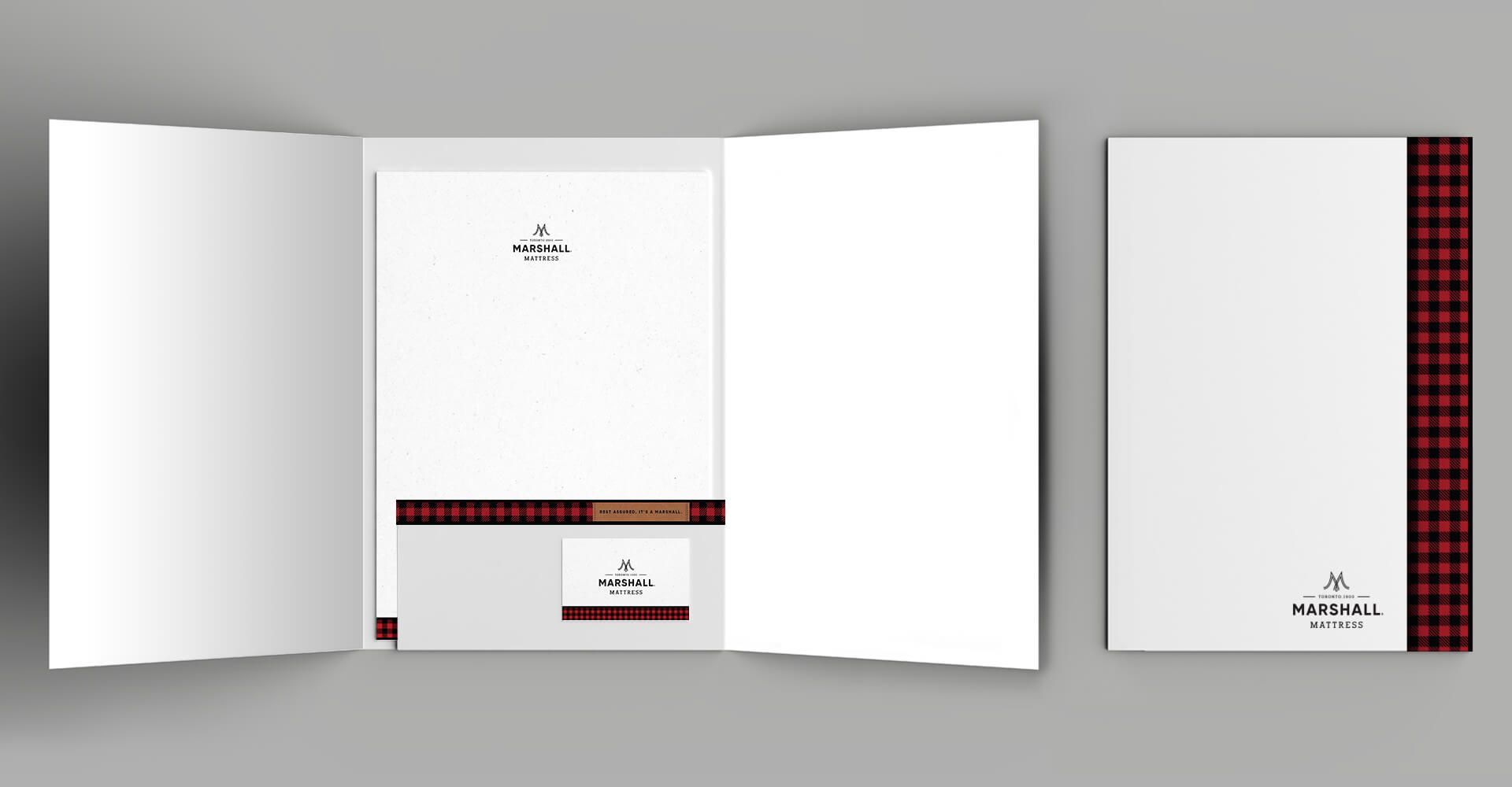 A folder with a letterhead and business card inside of it