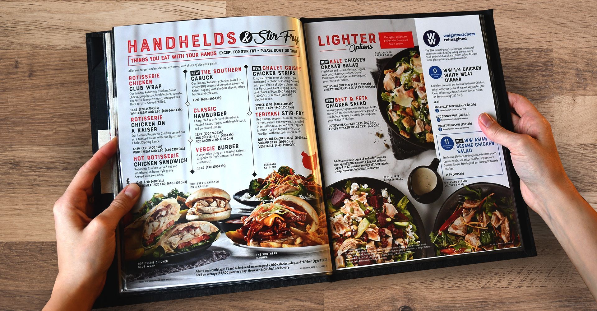 A person is holding a menu with a picture of food on it.