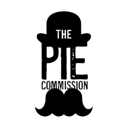 A black and white logo for the pie commission with a hat and mustache.