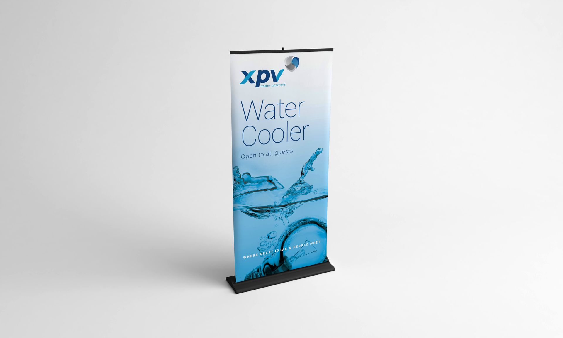 A roll up banner for xpv water cooler is sitting on a table.