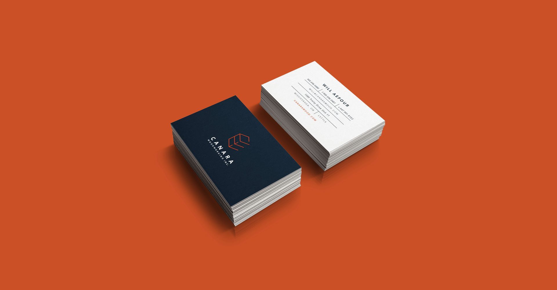 Two business cards are stacked on top of each other on a red background.