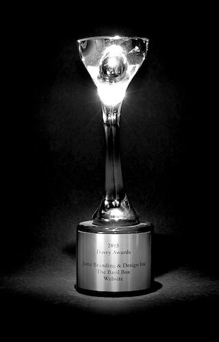 A black and white photo of a trophy with a light inside of it.