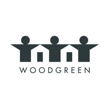 The logo for woodgreen is a group of people holding hands.