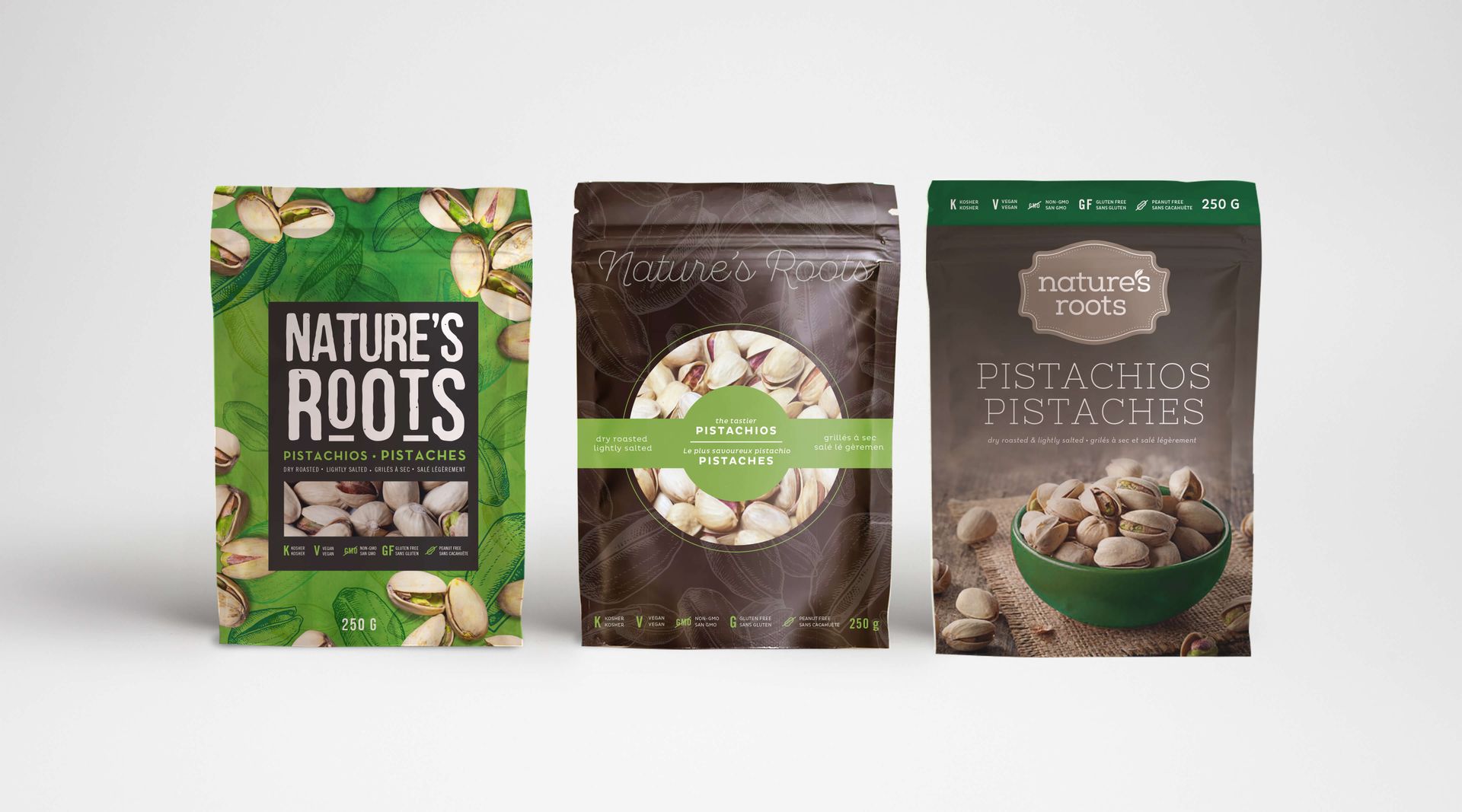 Three bags of pistachios are sitting next to each other on a table.