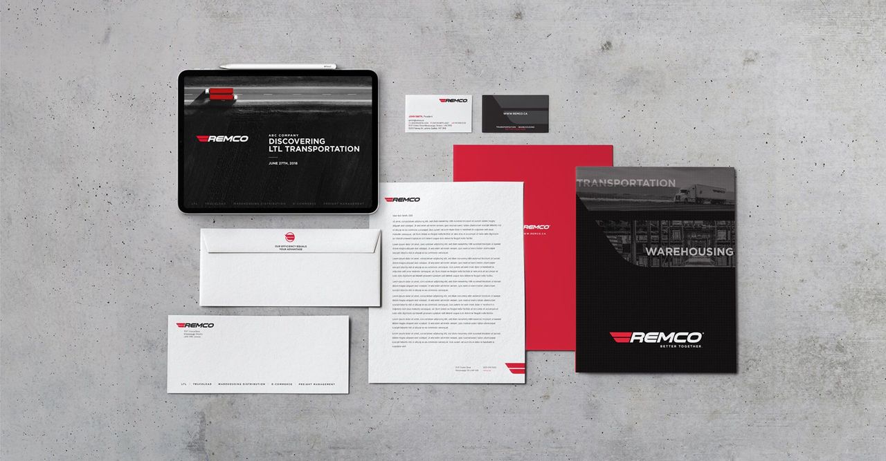A mockup of business cards , envelopes , and a tablet on a concrete surface.