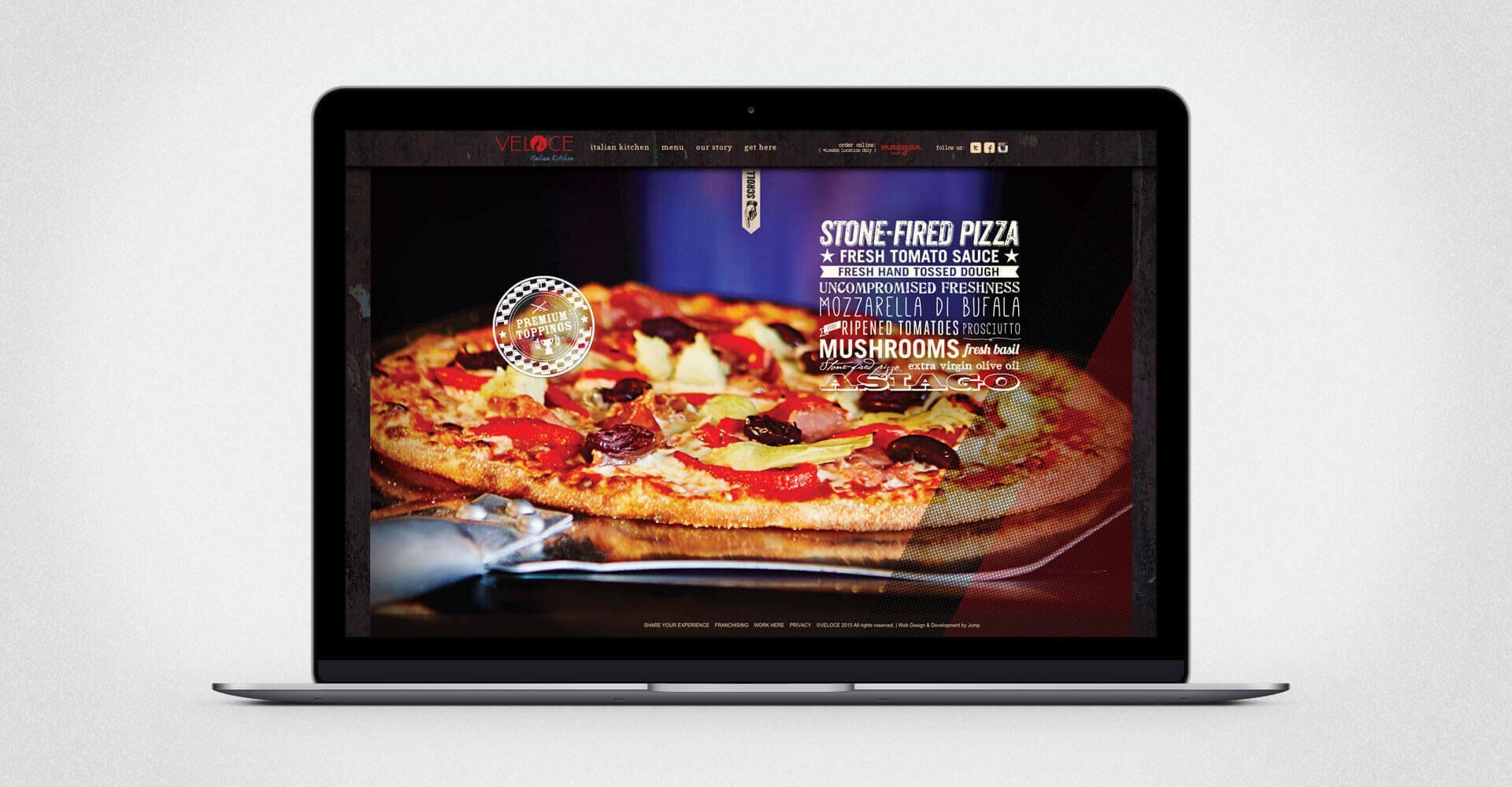 A laptop with a picture of a pizza on the screen