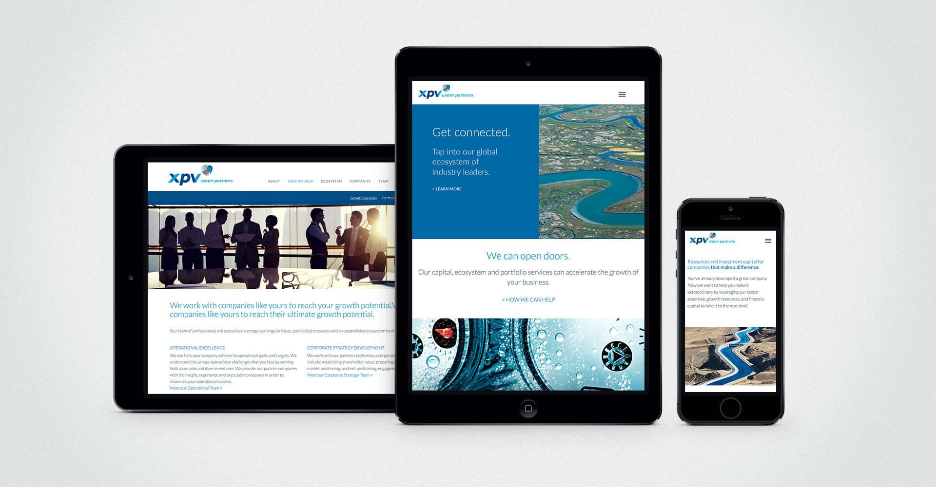 A tablet , a phone , and a tablet with a website on them.
