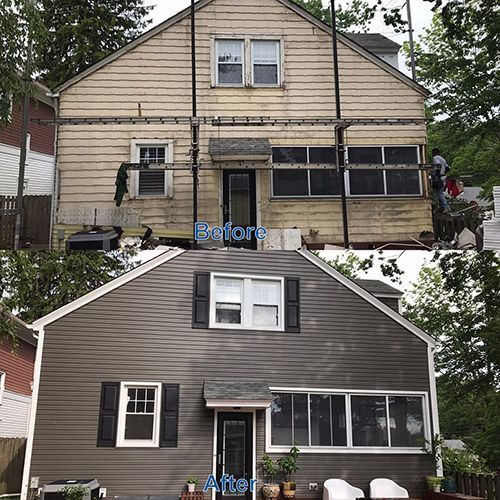 Before and after house exterior renovation: tan siding to gray siding, black shutters and door.