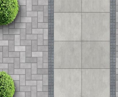 Overhead view of a walkway design with gray paving stones, rectangular concrete slabs, and green shrubbery.