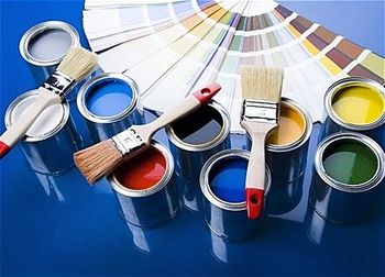 paintswatches, open paint cans and paint brushes
