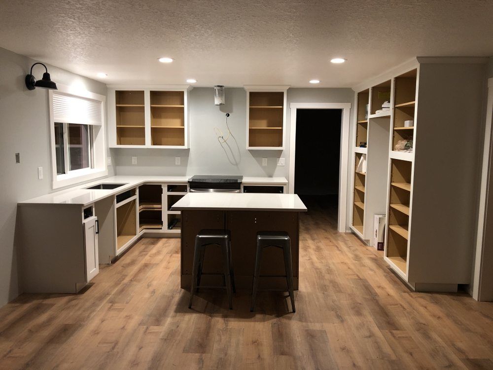 A kitchen with a large island in the middle of the room.