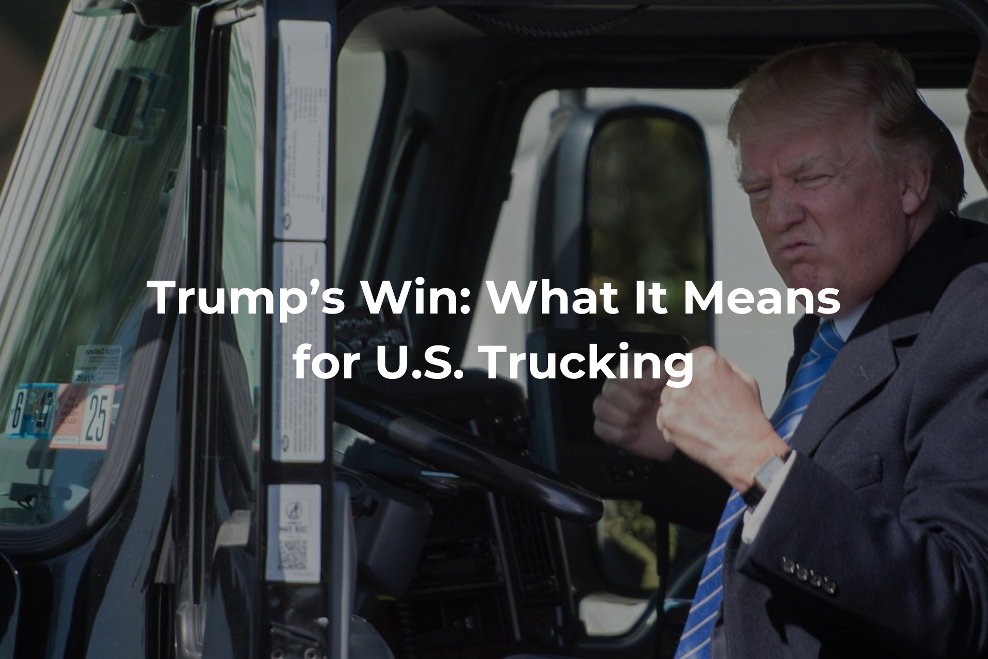 A man in a suit and tie is driving a truck.