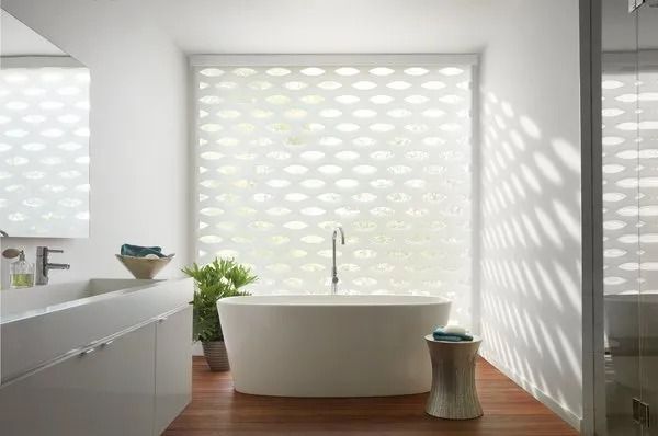 Cellular shades in coastal bathroom — open