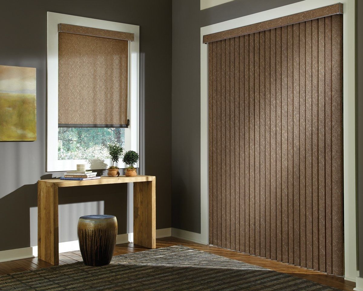 A living room with vertical blinds and a wooden table.