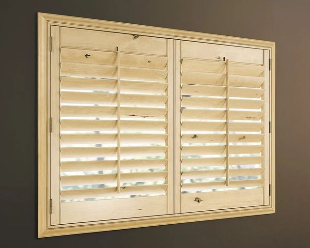 Heritance hardwood plantation shutters with rustic finish installed in a Minneapolis home