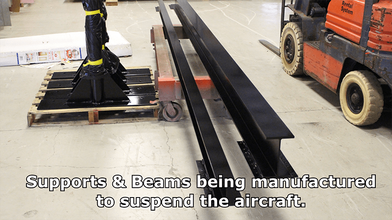 Supports and beams being manufactured to suspend the aircraft