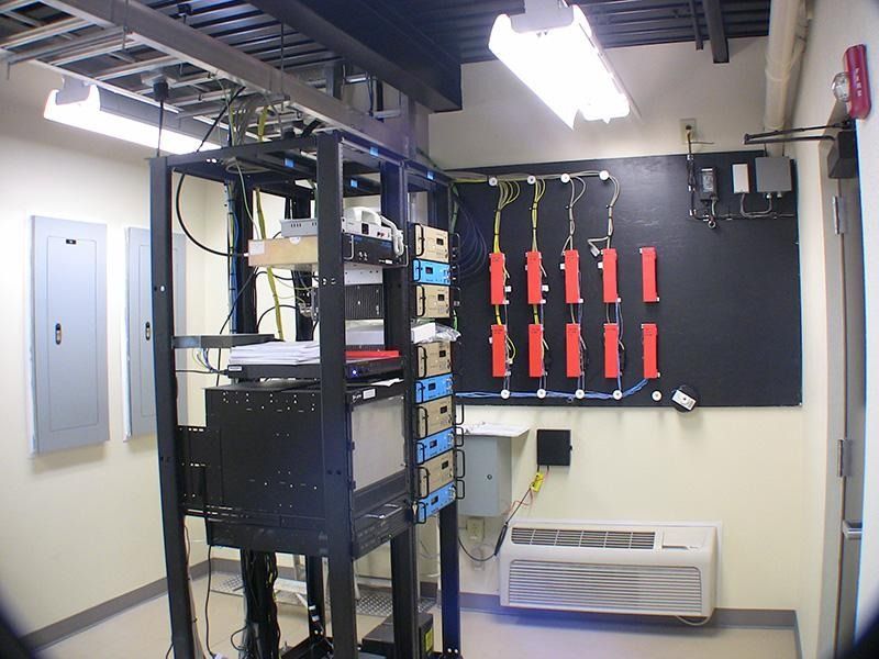 A room with a lot of wires hanging from the ceiling