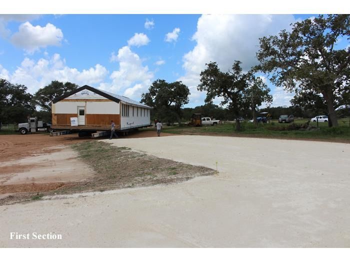The first section of a house is being built on a trailer