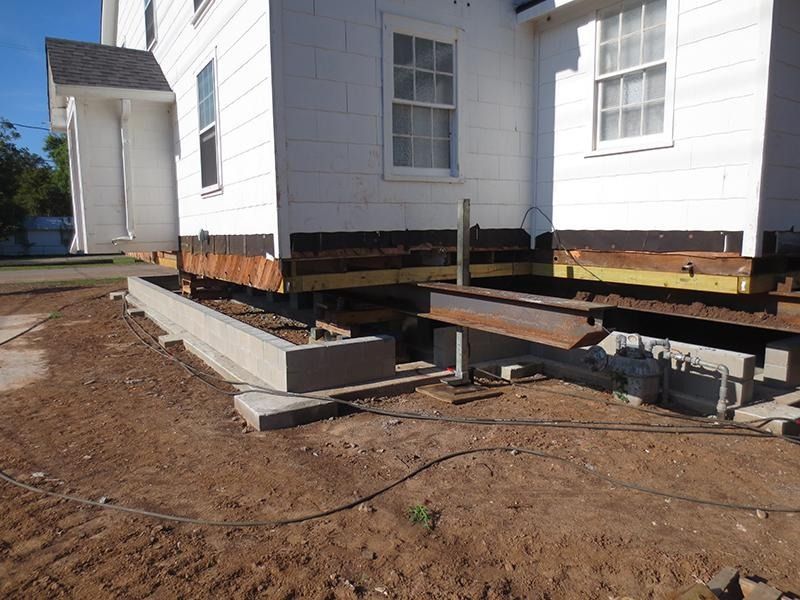 A white house is being moved to a new location.