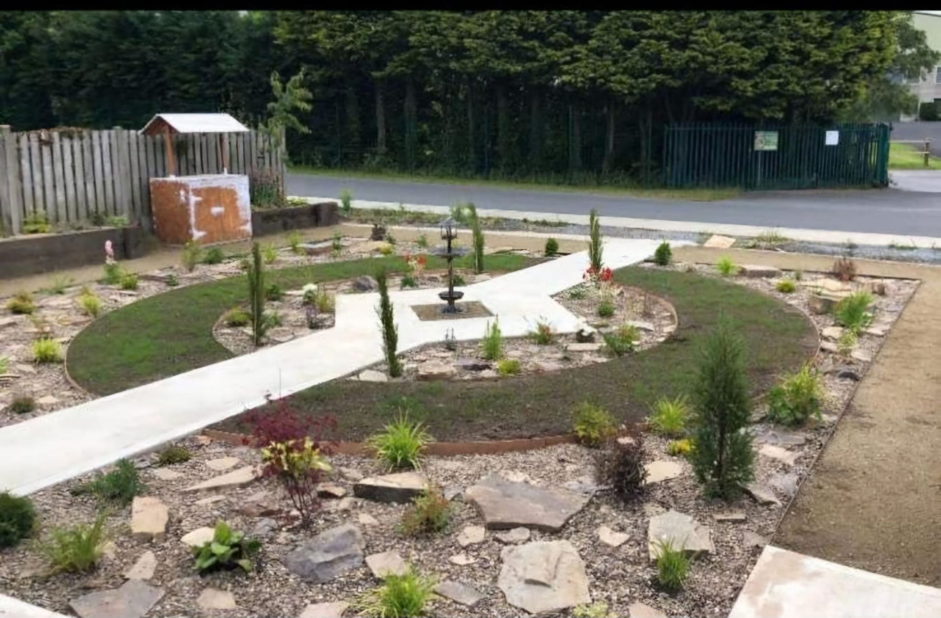 A circular garden with a walkway in the middle of it