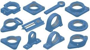 Alloggiamenti dei cuscinetti in metallo blu e relative parti meccaniche, disposti in una griglia.