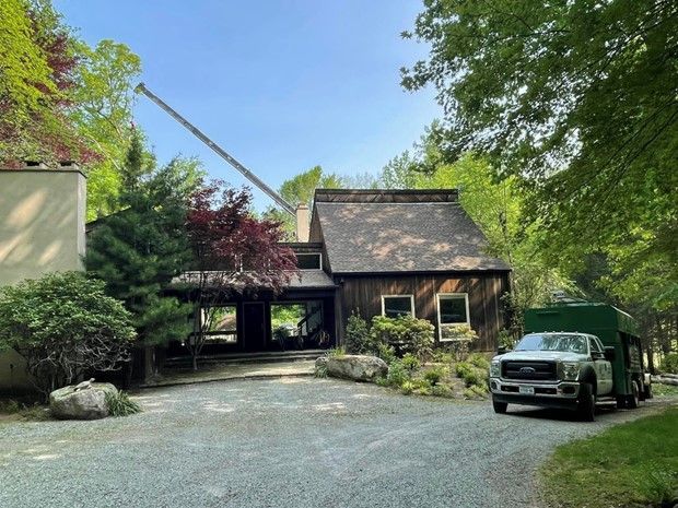 A ford truck is parked in front of a house