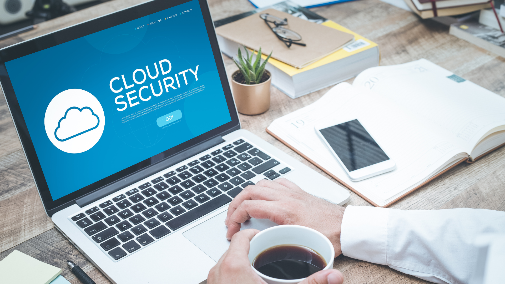 Business manager studies the meaning and benefits of cloud-based security on their computer