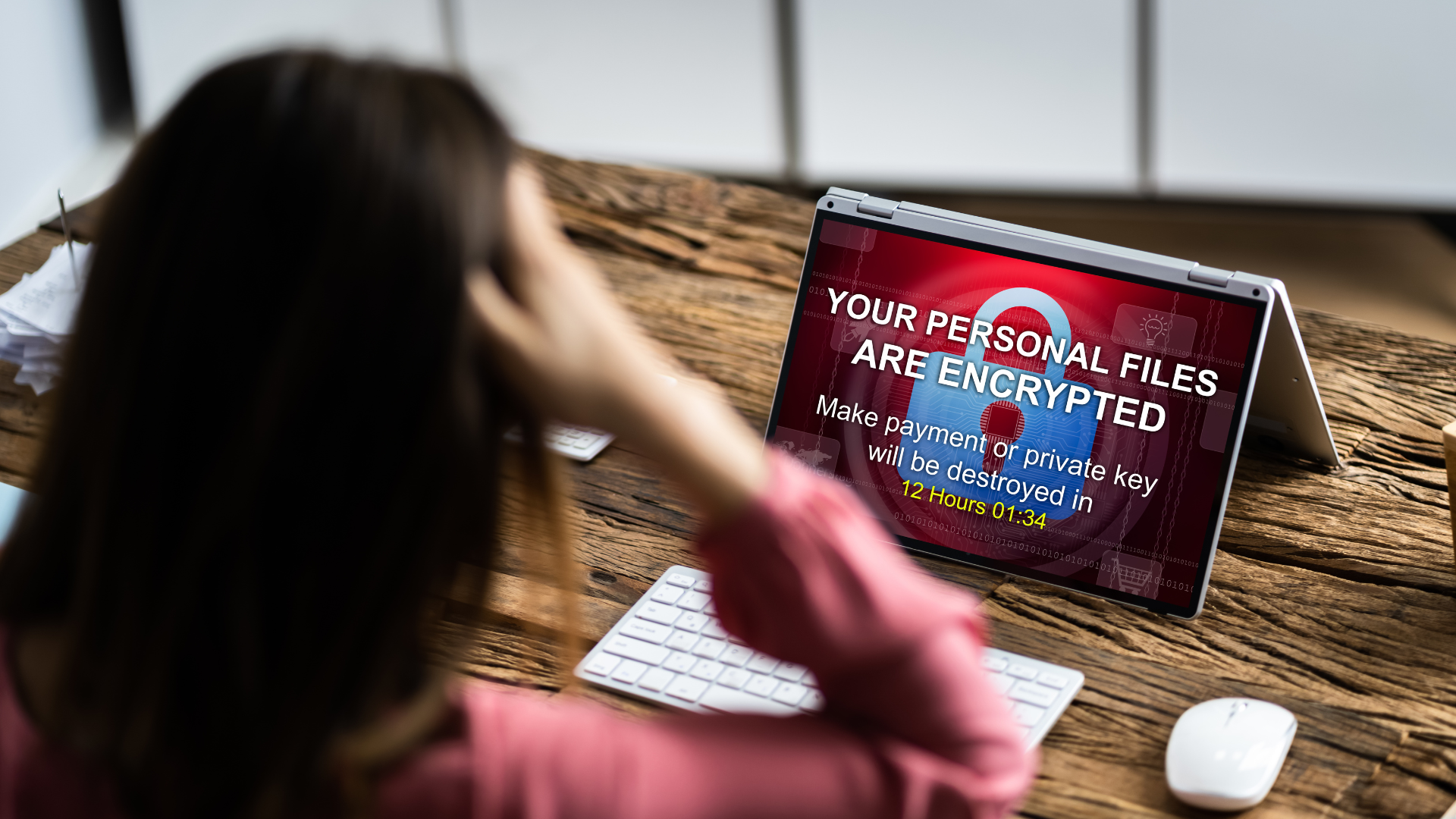 A remote employee's laptop is hit with ransomware because of a lack of cybersecurity for work-from-home systems