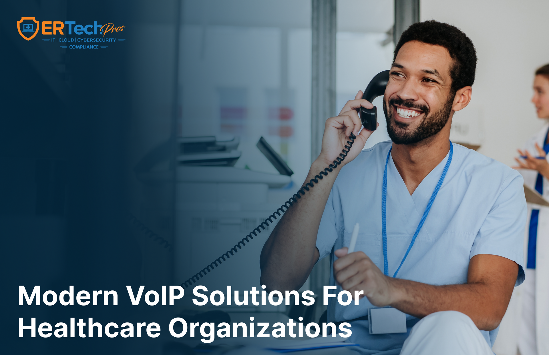 A business owner uses a VoIP phone while reviewing call management tools on their computer.