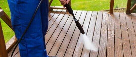 Cleaning Wooden Terrace with High Pressure Washer — Pressure Washer Services in New Galilee, PA