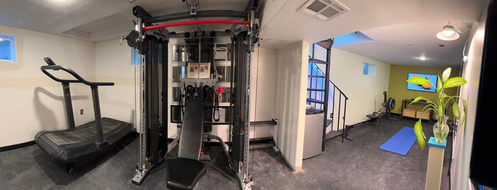 There is a treadmill in the middle of the room.