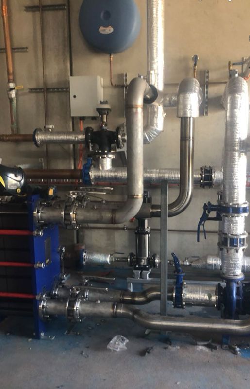 A Room Filled With Lots Of Pipes And Valves — BJB Plumbing & Gasfitting in Dubbo, NSW