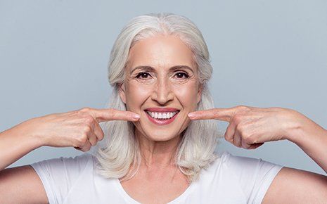 Happy Senior With Dentures — Venice, FL — Davis & Beyer Dental Health Professionals