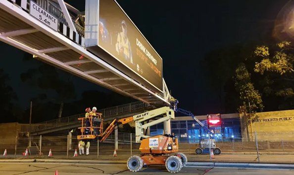 People fixing the overpass